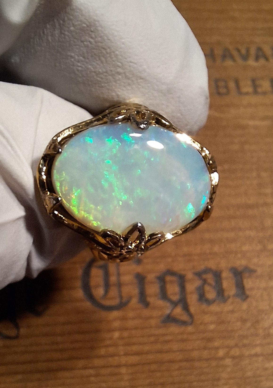 Opal ring on hand